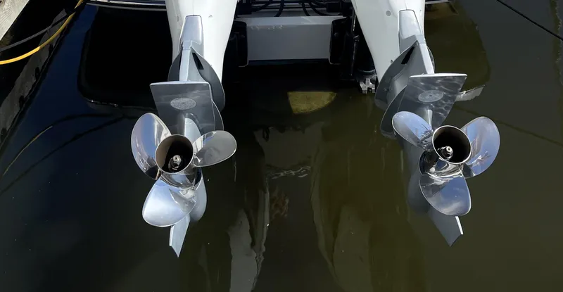 Slide: The Image of Twin propellers of a 2020 Monterey 345 Sport Yacht in water. - 4
