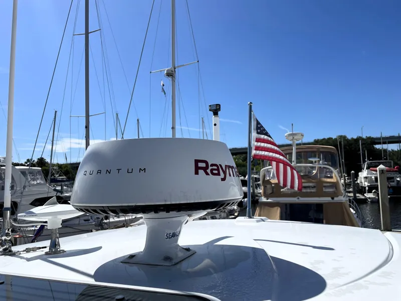 Slide: The Image of Monterey 345 Sport Yacht 2020 with radar and American flag at marina. - 40
