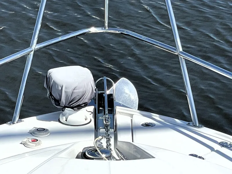 Slide: The Image of Monterey 345 Sport Yacht 2020 bow with anchor and railing on water. - 42