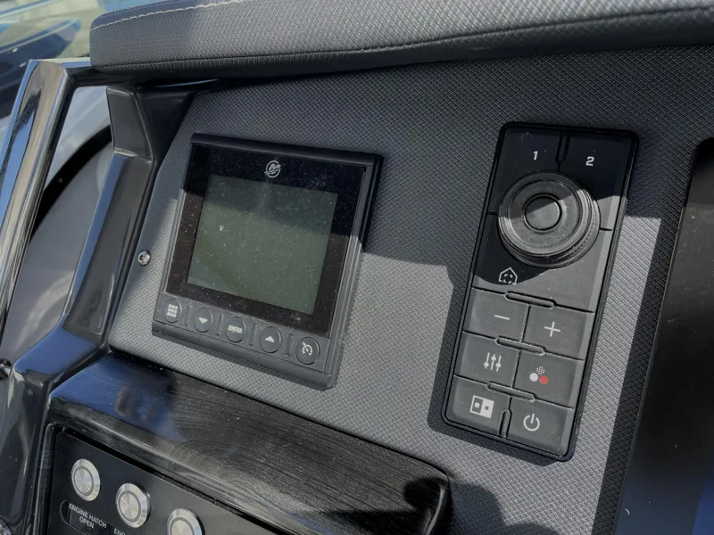 Slide: The Image of Control panel of 2020 Monterey 345 Sport Yacht with digital display and buttons. - 45