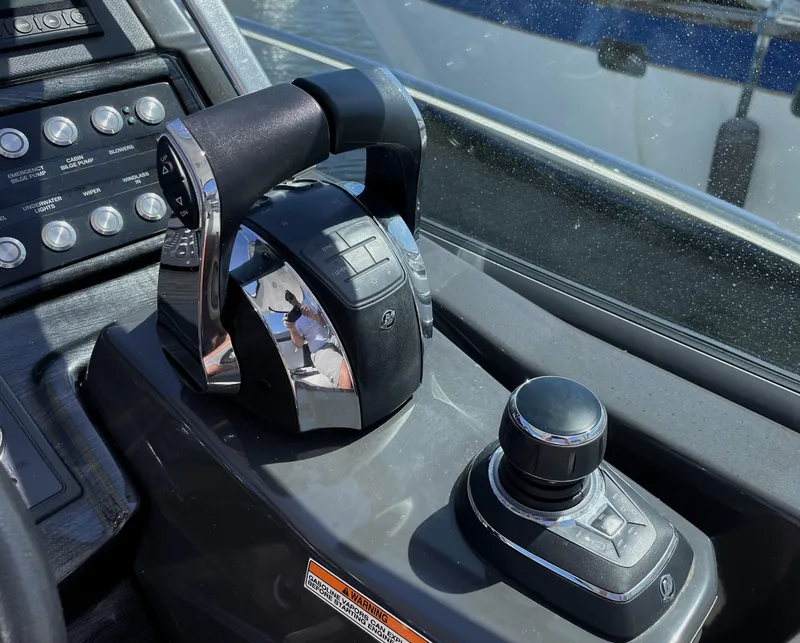 Slide: The Image of Throttle controls on a 2020 Monterey 345 Sport Yacht dashboard. - 47