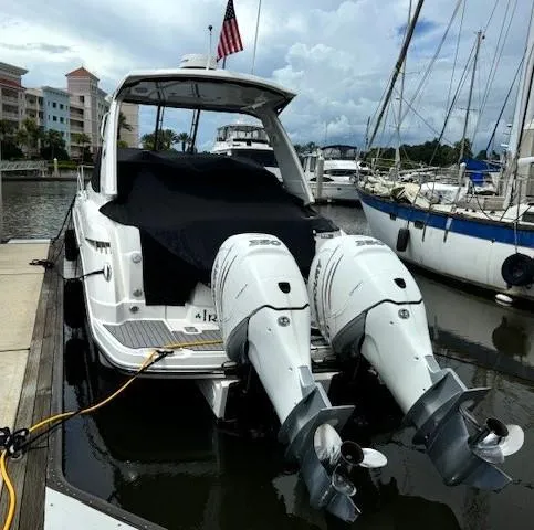Slide: The Image of 2020 Monterey 345 Sport Yacht docked with twin outboard engines. - 8