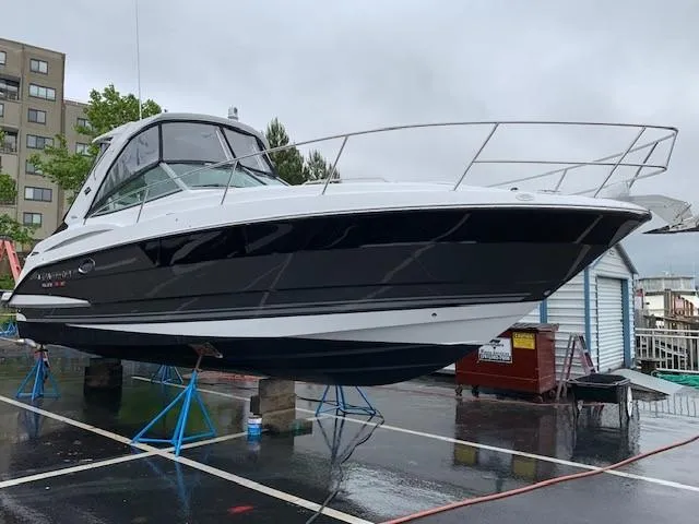 Slide: The Image of 2020 Monterey 345 Sport Yacht on stands in a marina parking lot. - 9