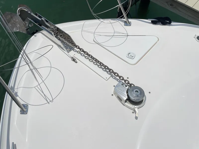 Slide: The Image of Bow of 1998 Sea Ray 420 Aft Cabin with anchor chain and winch. - 24