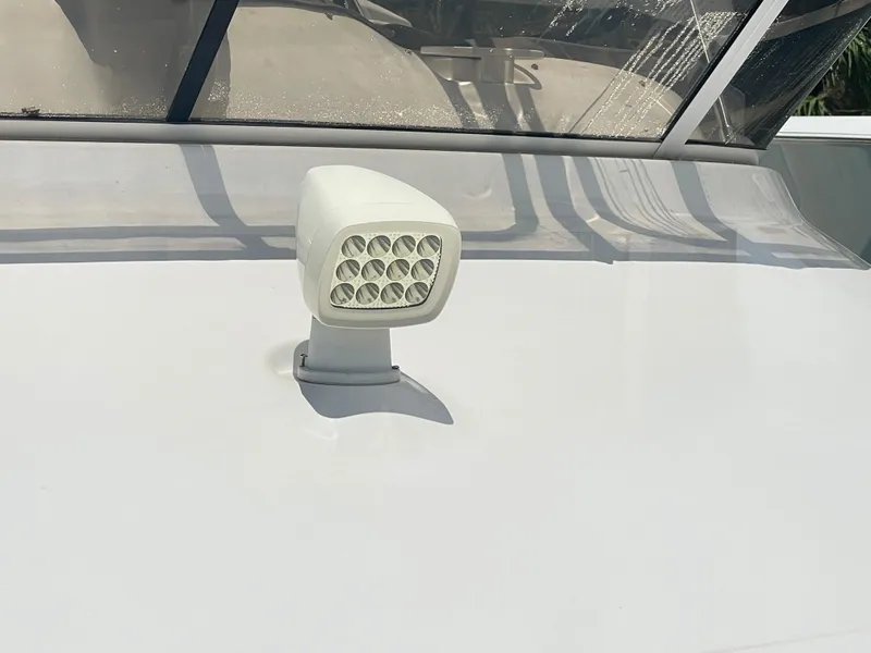 Slide: The Image of 1998 Sea Ray 420 Aft Cabin spotlight on deck, under clear skies. - 26