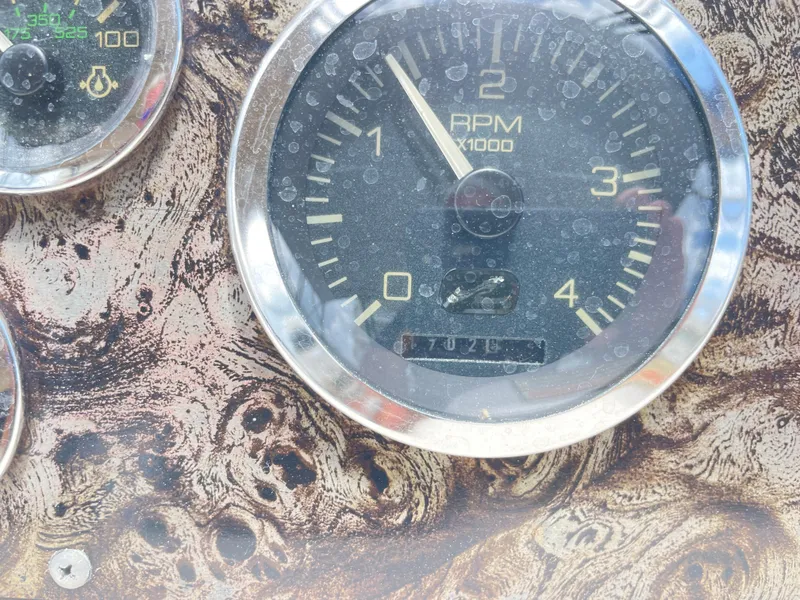 Slide: The Image of Close-up of a 1998 Sea Ray 420 Aft Cabin RPM gauge. - 35