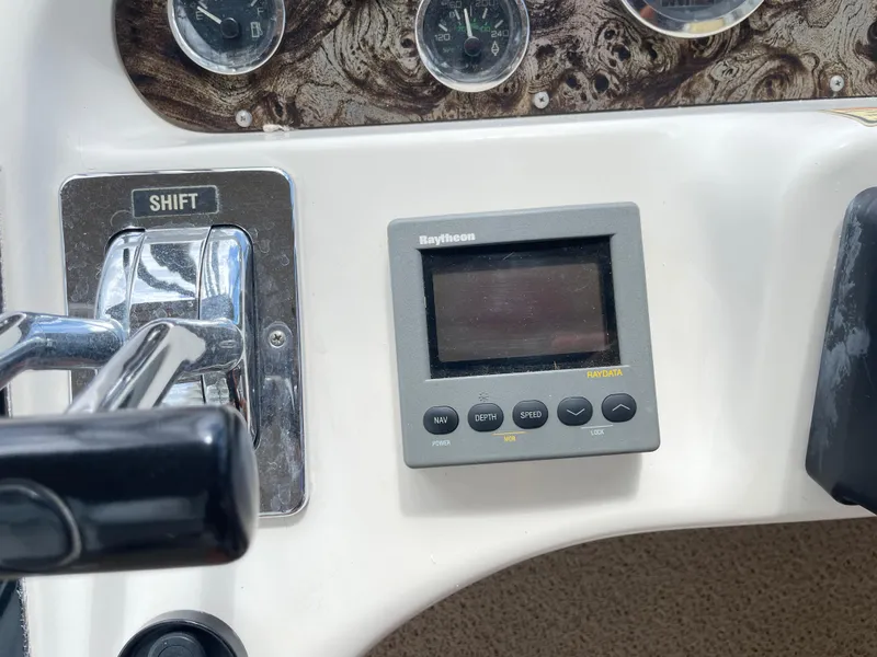 Slide: The Image of Control panel of a 1998 Sea Ray 420 Aft Cabin with Raytheon display. - 38