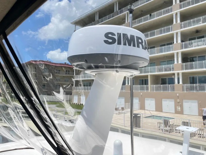 Slide: The Image of Radar equipment on a 1998 Sea Ray 420 Aft Cabin yacht, with buildings in the background. - 41