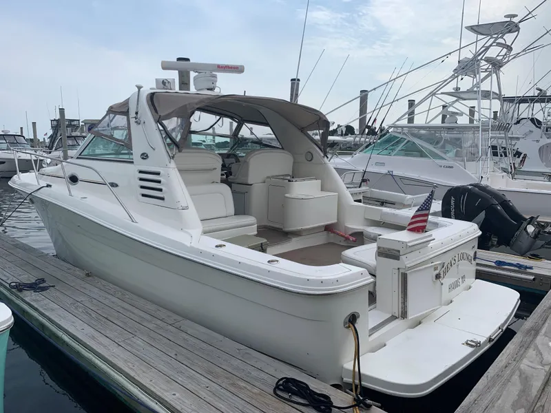 Slide: The Image of 2001 Sea Ray 340 Amberjack docked at a marina, rear view. - 0