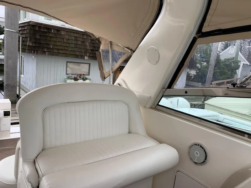 Slide: The Image of Interior seating of 2001 Sea Ray 340 Amberjack boat with white upholstery. - 10