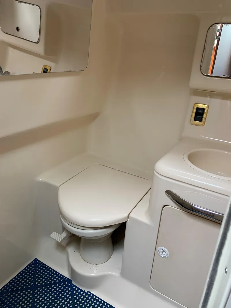 Slide: The Image of Bathroom in 2001 Sea Ray 340 Amberjack boat with toilet, sink, and mirror. - 14