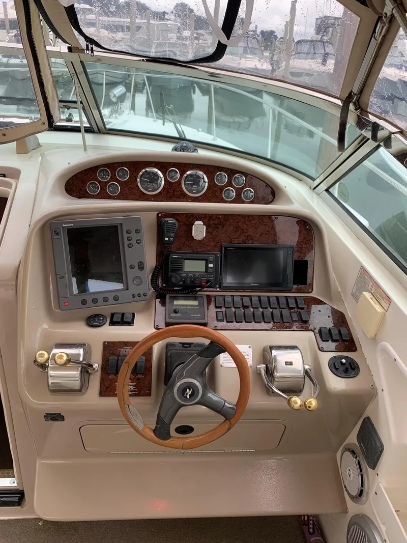 Slide: The Image of Helm of 2001 Sea Ray 340 Amberjack with navigation and control instruments. - 6
