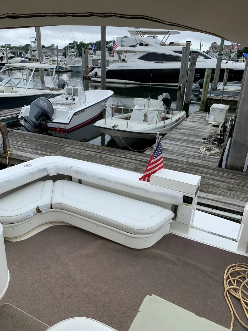 Slide: The Image of 2001 Sea Ray 340 Amberjack at marina with other boats. - 8