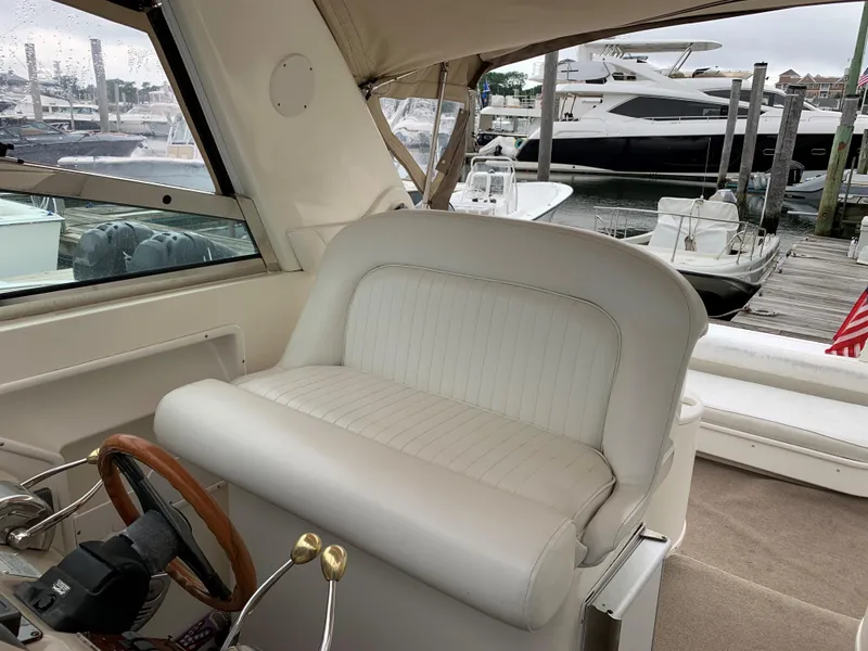 Slide: The Image of Interior of a 2001 Sea Ray 340 Amberjack boat at a marina. - 9