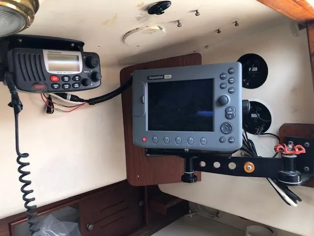 Slide: The Image of 1983 Cape Dory 28 boat interior with navigation and communication equipment. - 33