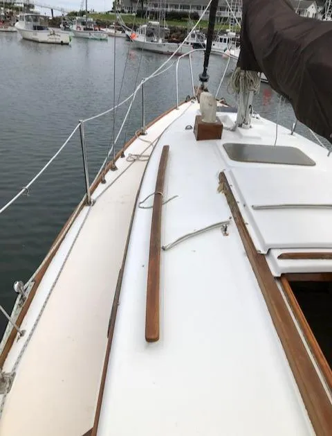 Slide: The Image of 1983 Cape Dory 28 sailboat deck view, docked in a marina. - 8