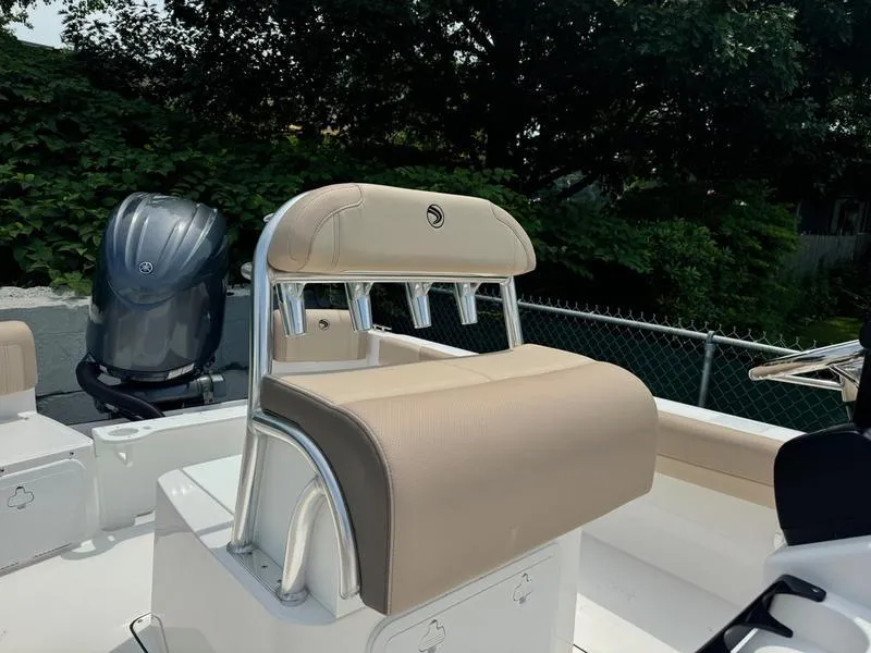 Slide: The Image of 2025 Edgewater 188 CC boat with beige seating and outboard motor. - 3
