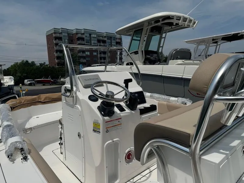 Slide: The Image of 2025 Edgewater 188 CC center console boat with Garmin navigation system. - 9