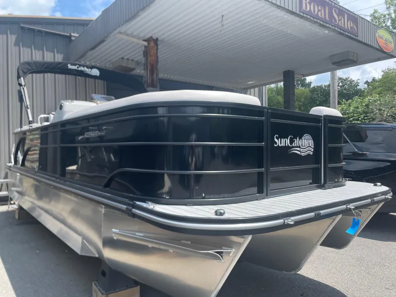 Slide: The Image of 2024 SunCatcher Select 324RC pontoon boat at dealership. - 1
