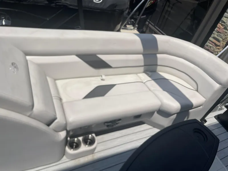 Slide: The Image of 2024 SunCatcher Select 324RC boat interior seating with cup holders. - 10