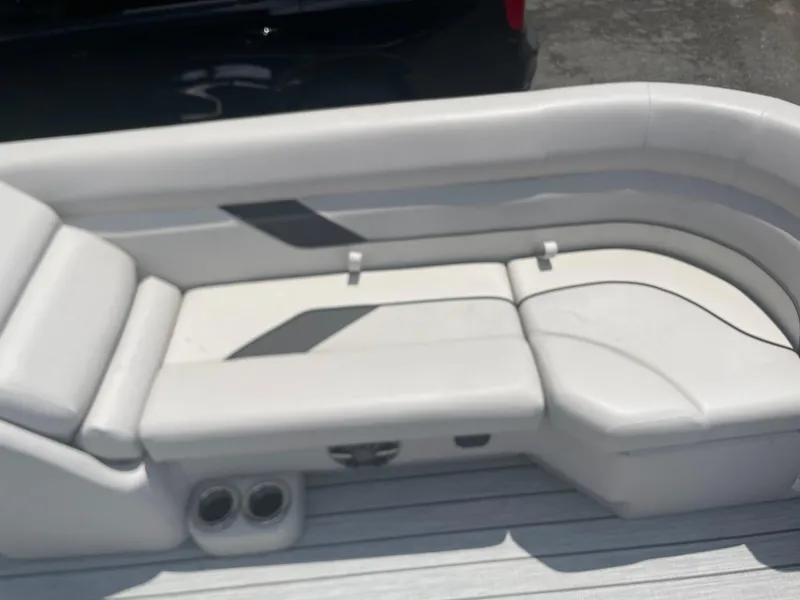 Slide: The Image of 2024 SunCatcher Select 324RC boat interior seating with cup holders. - 4