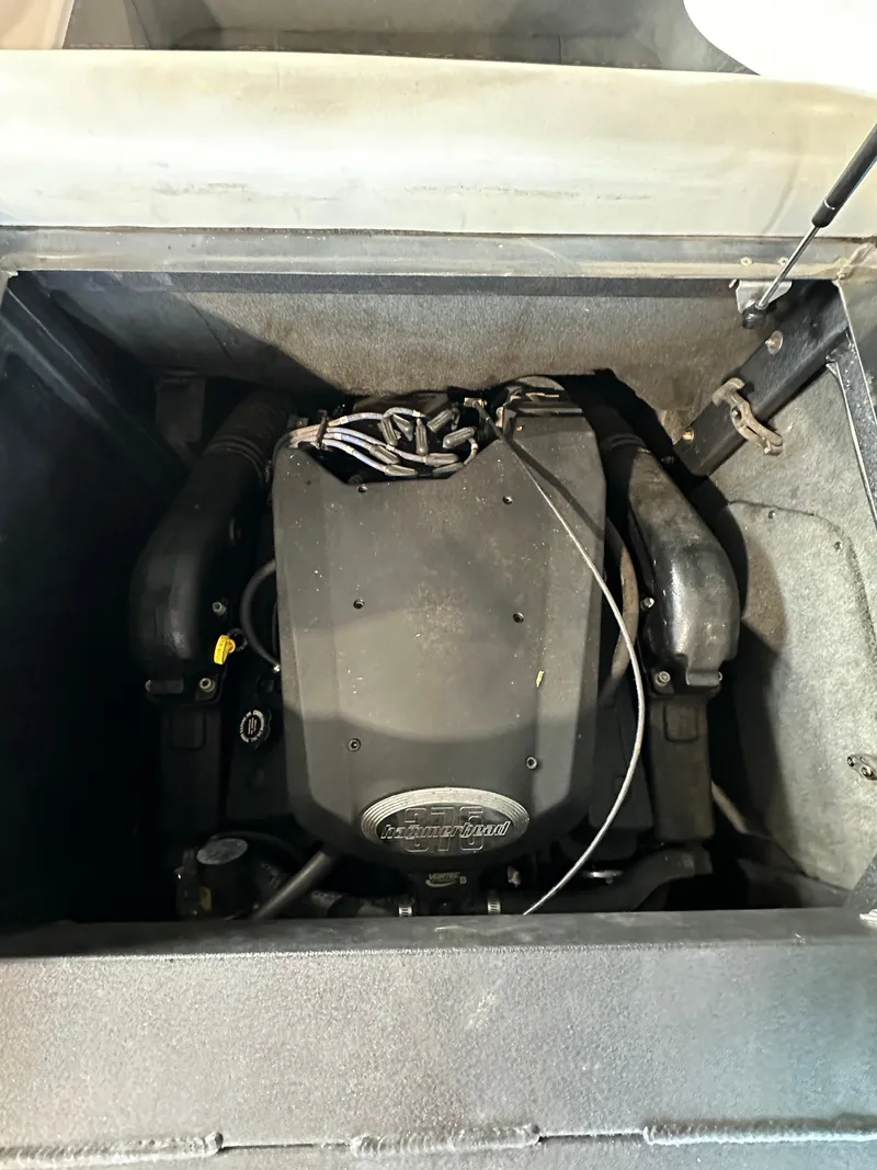 Slide: The Image of 2003 Malibu Wakesetter 23 XTi engine compartment with visible engine components. - 12