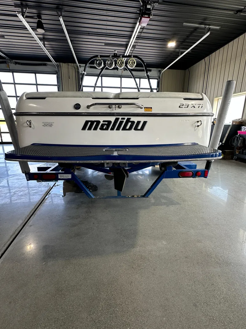 Slide: The Image of 2003 Malibu Wakesetter 23 XTi boat on a trailer in a garage. - 14