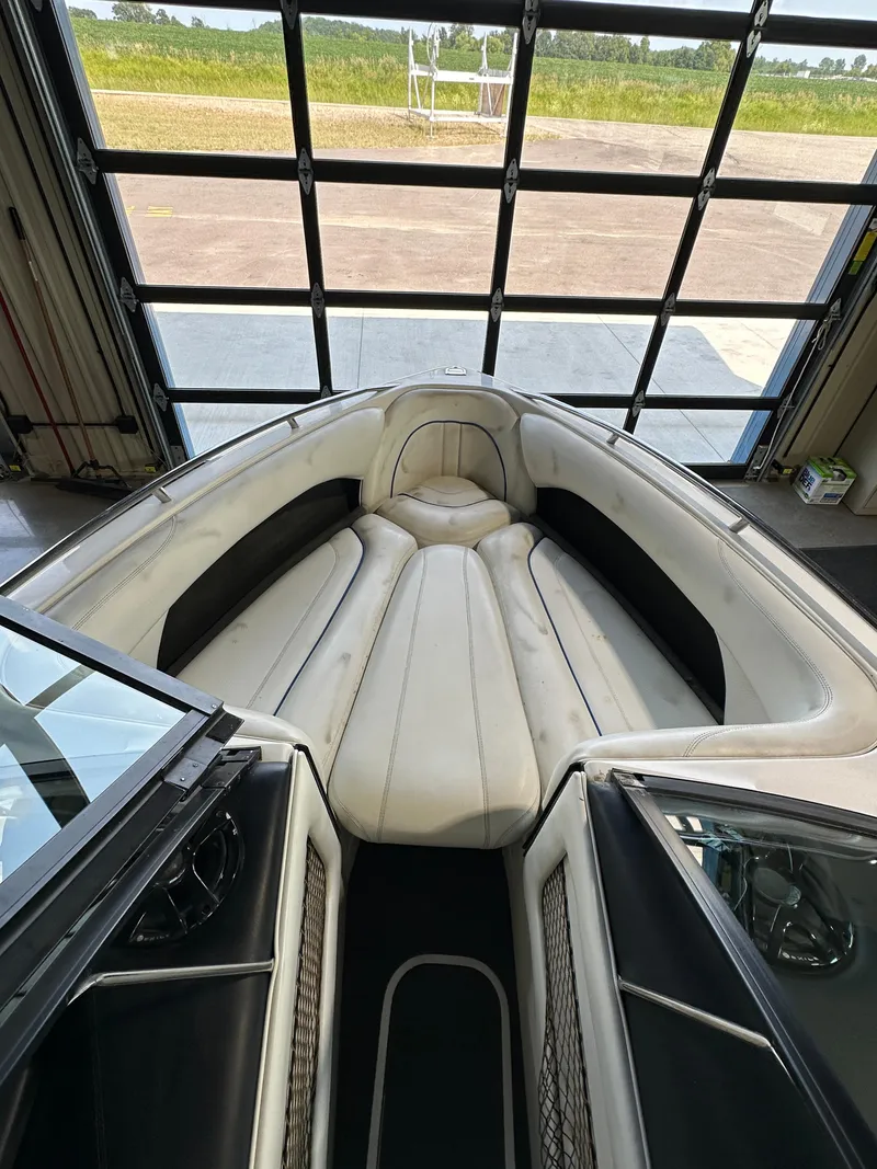 Slide: The Image of Interior of a 2003 Malibu Wakesetter 23 XTi boat with white and black seating. - 7
