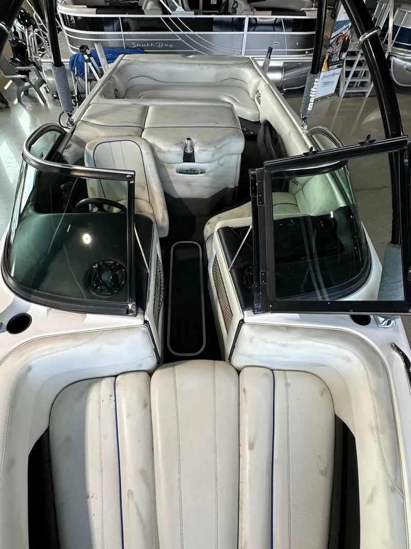 Slide: The Image of 2003 Malibu Wakesetter 23 XTi interior view with open windshield and seating. - 8
