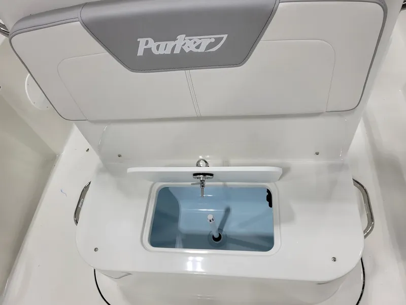 Slide: The Image of 2025 Parker 18 SE CC boat seat with integrated storage compartment. - 13