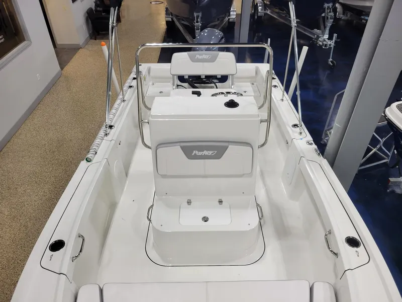 Slide: The Image of 2025 Parker 18 SE CC boat interior with white seating and console. - 14