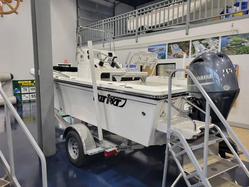 Slide: The Image of 2025 Parker 18 SE CC boat on trailer in showroom with Yamaha engine. - 5