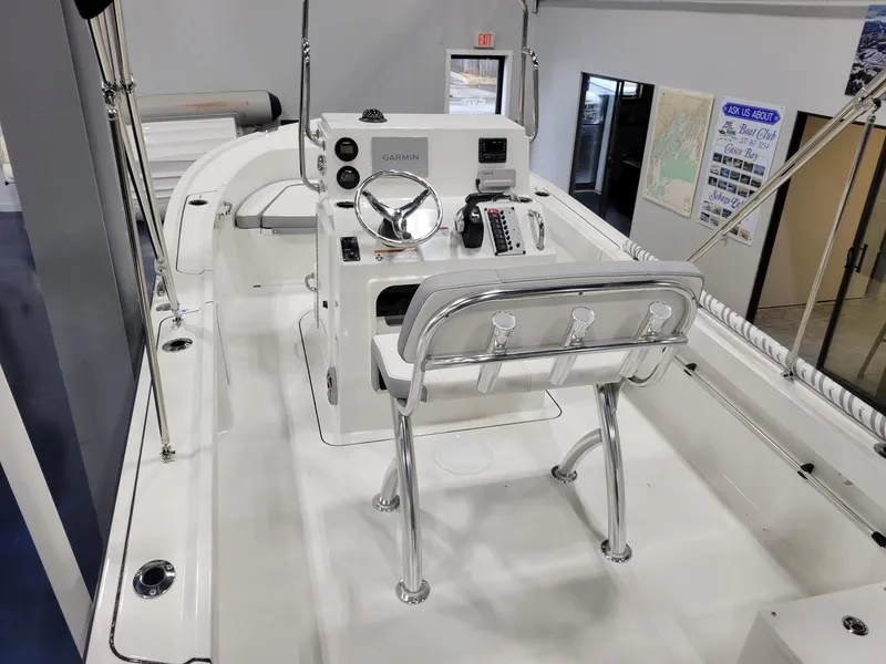 Slide: The Image of 2025 Parker 18 SE CC boat interior with steering console and seating. - 7