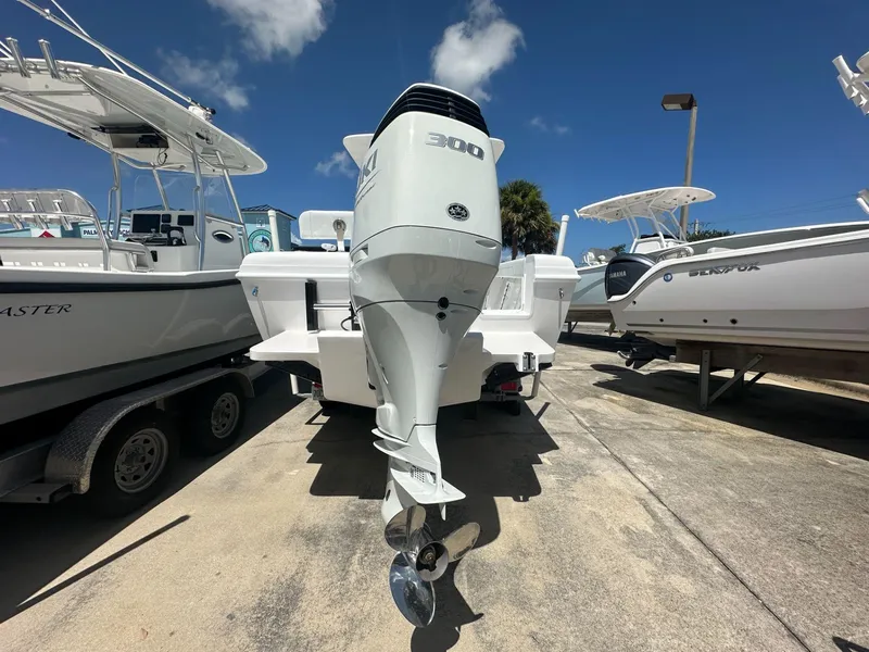 Slide: The Image of 2025 Blue Water 23T CC boat with a powerful 300 HP outboard engine. - 3