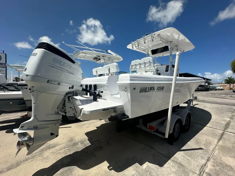 Slide: The Image of 2025 Blue Water 23T CC boat with Suzuki outboard motor on trailer. - 4