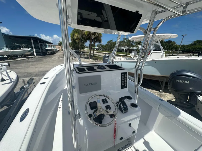 Slide: The Image of 2025 Blue Water 23T CC center console boat with Garmin electronics and Yamaha outboard motor. - 5