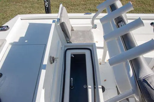 Slide: The Image of 2024 Avid 21 FSX boat interior with storage compartments and seating. - 12