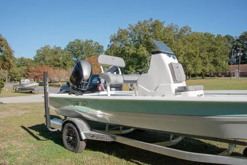 Slide: The Image of 2024 Avid 21 FSX boat on a trailer in a park. - 25