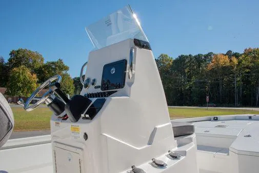 Slide: The Image of 2024 Avid 21 FSX boat console with steering wheel and navigation controls. - 7