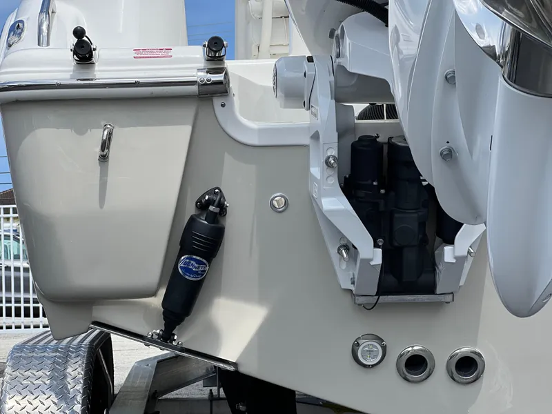 Slide: The Image of Close-up of the 2025 Key West 244 CC boat's engine and transom area. - 11