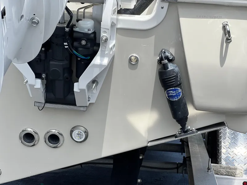 Slide: The Image of 2025 Key West 244 CC boat engine and hydraulic system close-up. - 12