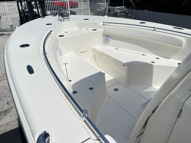 Slide: The Image of 2025 Key West 244 CC boat interior with spacious seating and storage. - 14