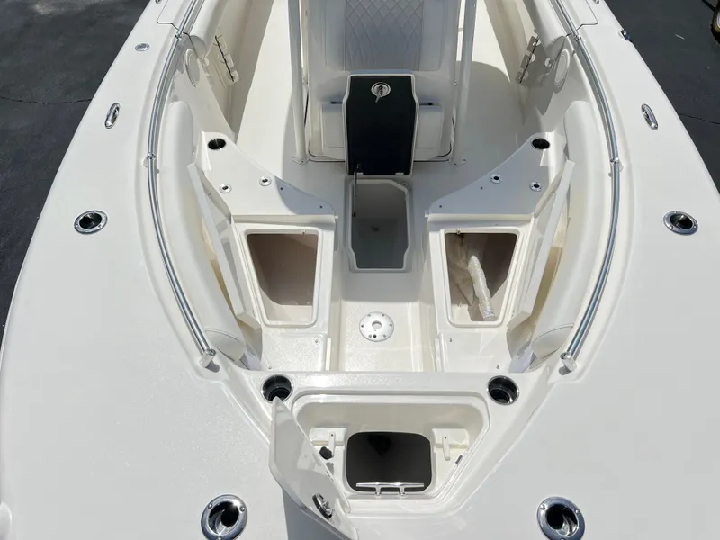 Slide: The Image of 2025 Key West 244 CC boat interior with open storage compartments. - 18