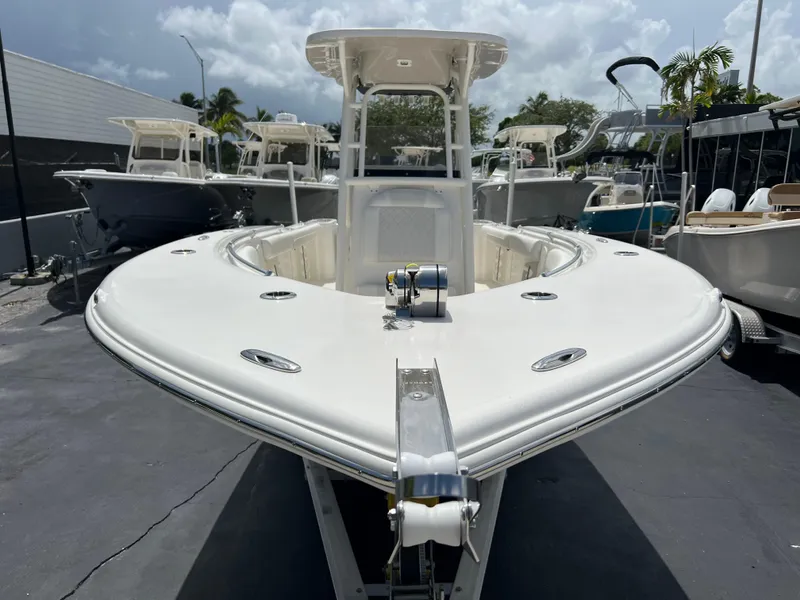 Slide: The Image of 2025 Key West 244 CC center console boat in a marina. - 2