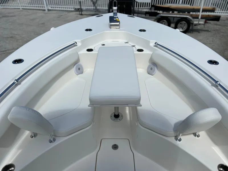 Slide: The Image of 2025 Key West 244 CC boat interior with white seating and table. - 22