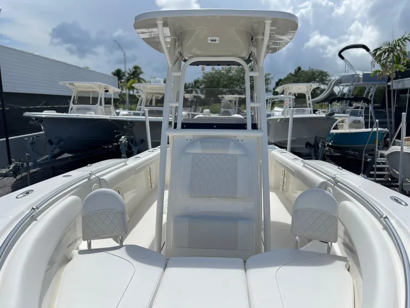 Slide: The Image of 2025 Key West 244 CC center console boat with white seating and T-top. - 26