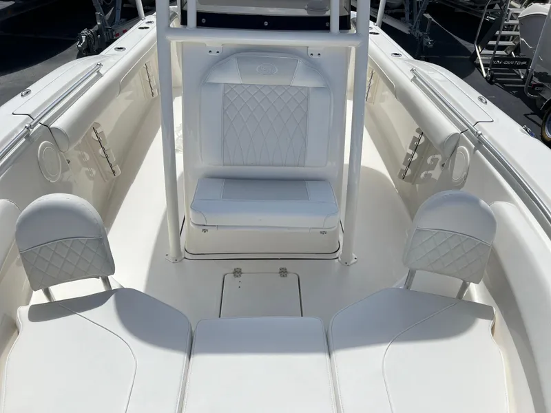 Slide: The Image of 2025 Key West 244 CC boat interior with white seating and diamond stitching. - 27