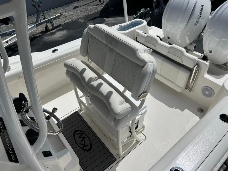 Slide: The Image of 2025 Key West 244 CC boat interior with dual seats and twin engines. - 30