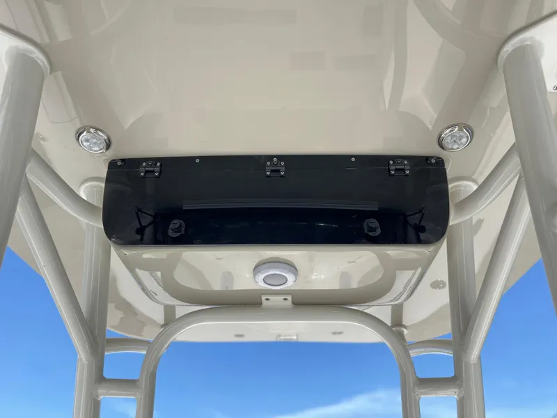 Slide: The Image of 2025 Key West 244 CC boat console with overhead storage and lighting. - 39