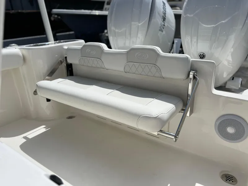 Slide: The Image of 2025 Key West 244 CC boat with foldable rear bench seat and twin outboard engines. - 44
